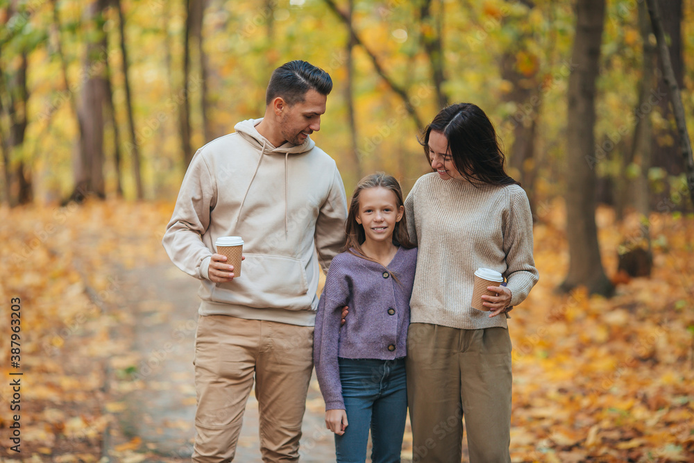 Portrait of happy family of three in autumn day Portrait of happy family of three in autumn day