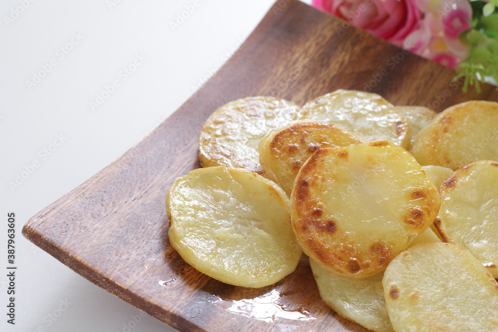 homemade fried potato on wooden plate with copy space homemade fried potato on wooden plate with copy space