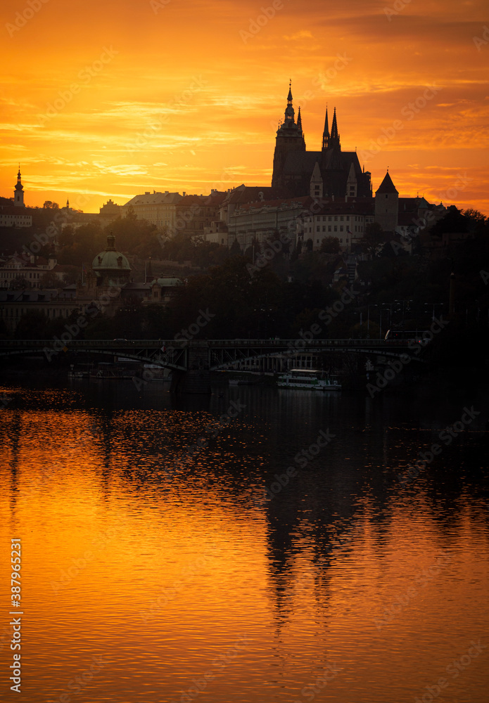 Sunset over the rive and Prague Castle, Czech Republic.