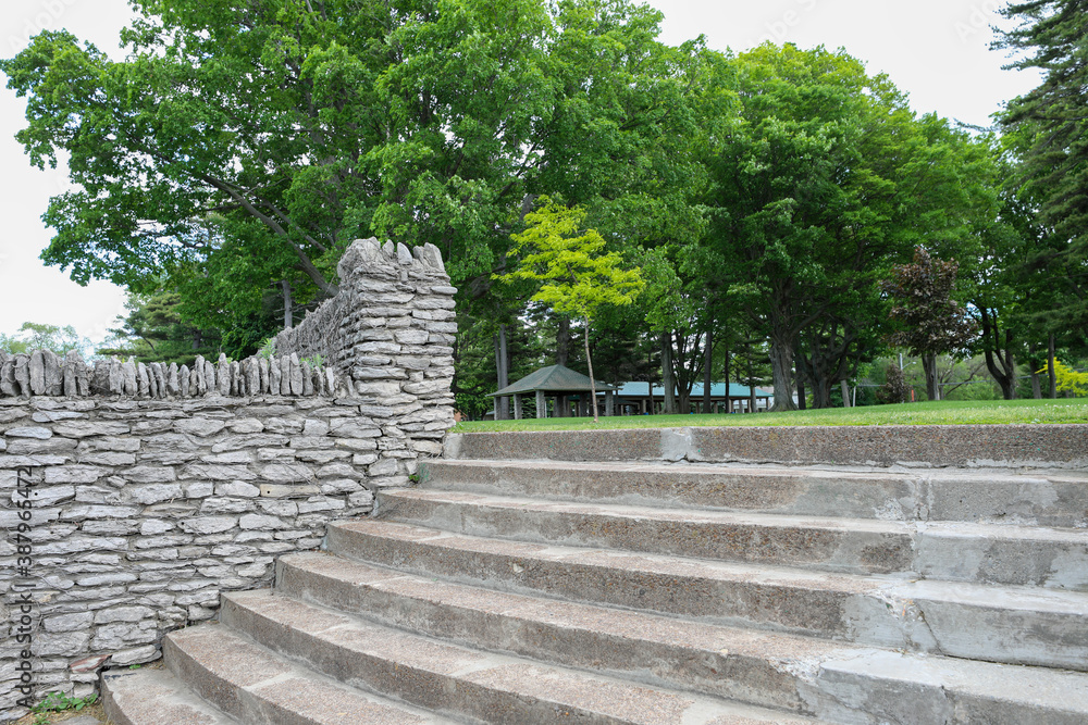 Krull Park  at Olcott Beach. Stone steps from the beach to the stone wall along the park. Olcott, New York