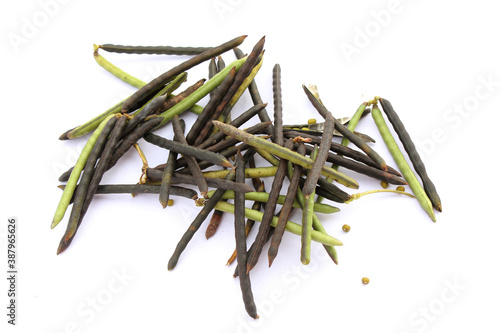 Mung beans and pods isolated on white background