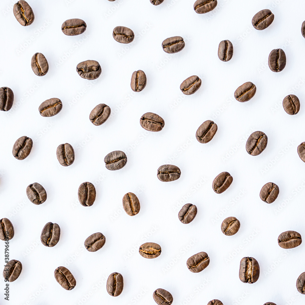 Pattern of roasted coffee beans arrange on white background Pattern of roasted coffee beans arrange on white background
