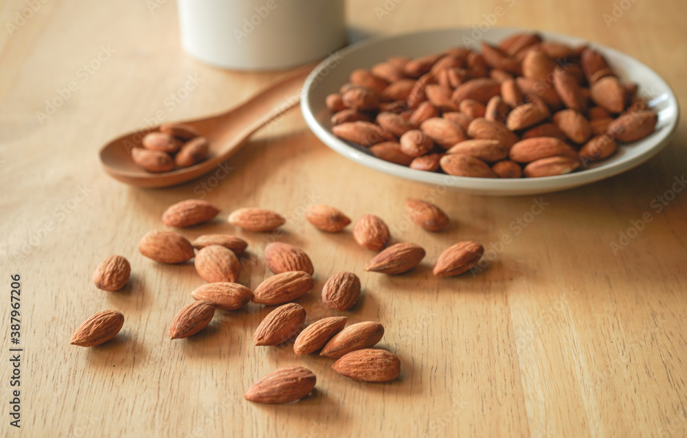 almond nut arrange on wood desk almond nut arrange on wood desk