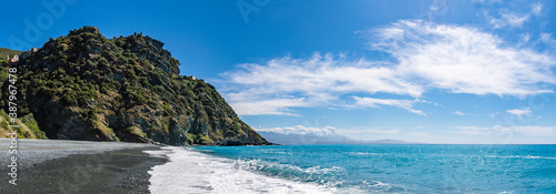 Nonza Beach in Corsica under a great blue sky photo