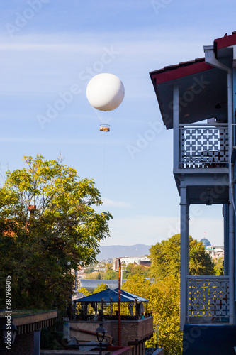 . City center and historical places in old town of Tbilisi and air balloon in the sky. photo