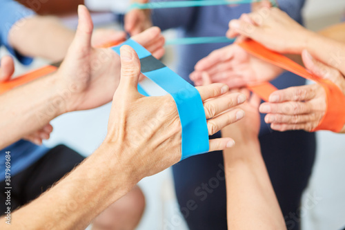 Hands do exercise with the elastic band