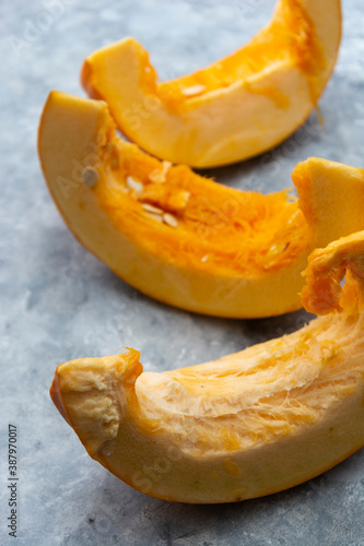 Slices of baked pumpkin isolated with copy space. Fall, autumn, seasonal food.