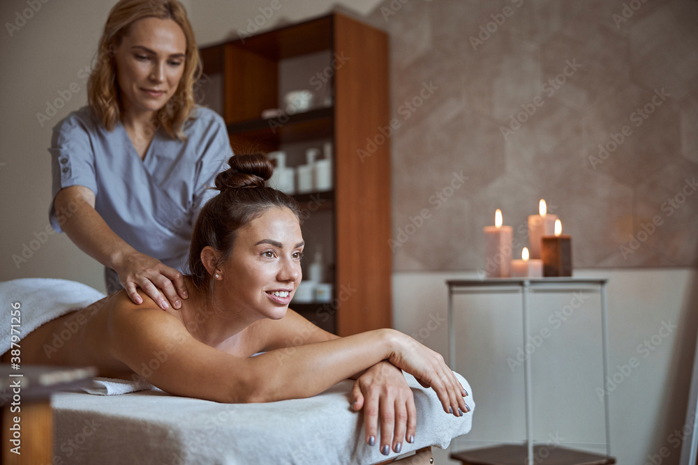 Young atractive female in massage salon is having beauty and healthcare procedures Young atractive female in massage salon is having beauty and healthcare procedures