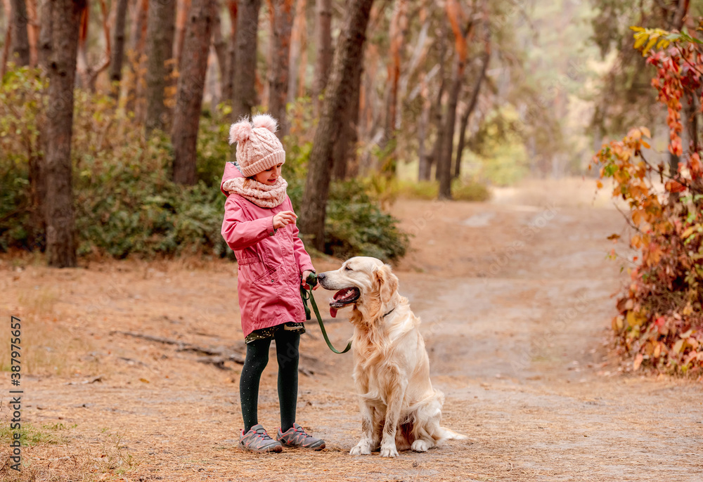 Little girl with dog running into forest Little girl with dog running into forest