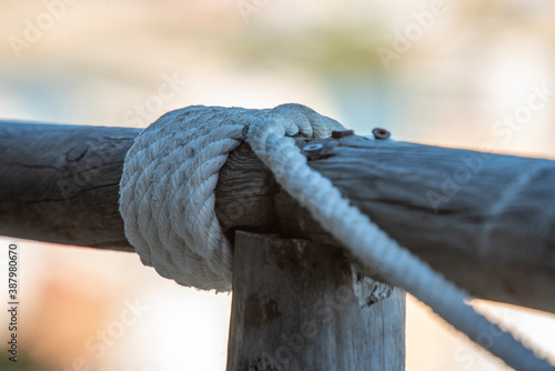 rope tied to a log of wood