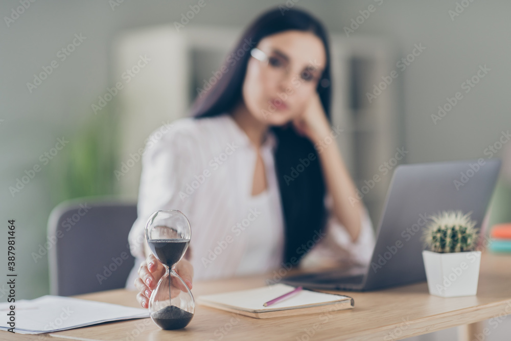 Close up photo of clever smart business woman sitting table typing laptop waiting last work minutes indoors workshop Close up photo of clever smart business woman sitting table typing laptop waiting last work minutes indoors workshop