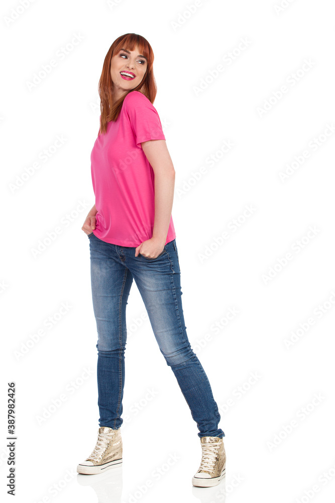 Beautiful Young Woman Is Looking Over The Shoulder And Smiling Beautiful Young Woman Is Looking Over The Shoulder And Smiling