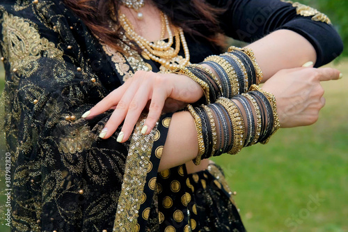 Woman in ethnic indian costume with jewellery and traditional makeup.