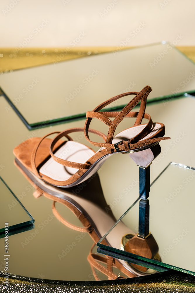brown suede elegant heeled sandals on mirror surface brown suede elegant heeled sandals on mirror surface