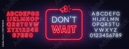 Don t wait neon sign in a frame with a megaphone on a brick wall background. Red and whte neon alphabet. Template for a design.