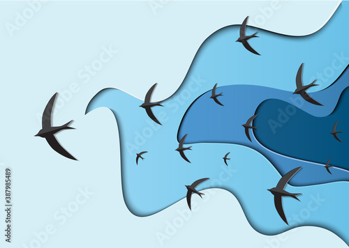 Paper cut cartoon black birds in blue sky in polygonal trendy craft style. Modern origami design. 
