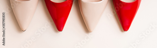top view of leather heeled shoes on beige background, banner
