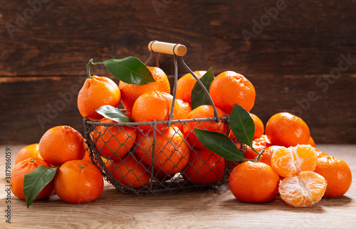 Fresh mandarin oranges fruit or tangerines in a basket