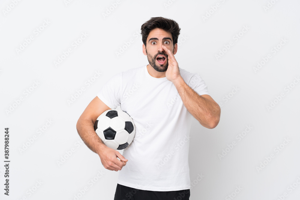 Young handsome man with beard over isolated white background shouting with mouth wide open