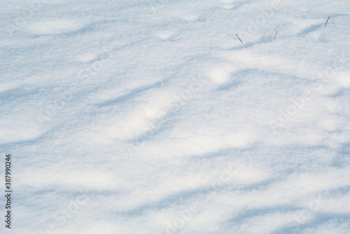 Surface of pure white snow with bumps