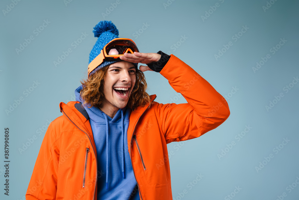 Caucasian excited sportsman posing and looking aside Caucasian excited sportsman posing and looking aside