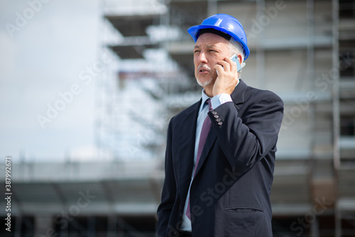 Portrait of an architect talking on the phone
