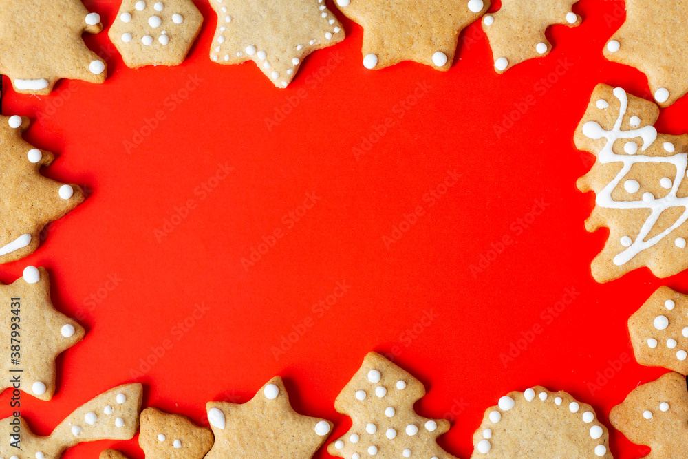 frame for new year xmas greetings, red background with gingrbread cookies