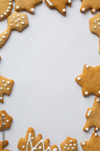 frame for new year xmas greetings, white background with gingrbread cookies photo