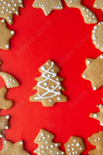 festive layout of New Year's christmas gingrerbread cookies on a red background. Merry Christmas and Happy New Year card