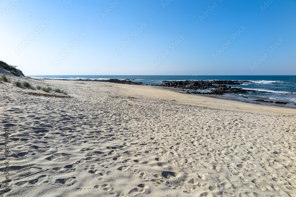 Obraz premium Beaches with fine white sand and blue sea, cloudless sky, city of Afife, parish of Viana do Castelo municipality, NUT III sub-region of Alto Minho, Portugal