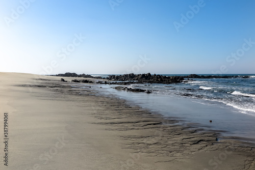 Beaches with fine white sand and blue sea  cloudless sky  city of Afife  parish of Viana do Castelo municipality  NUT III sub-region of Alto Minho  Portugal