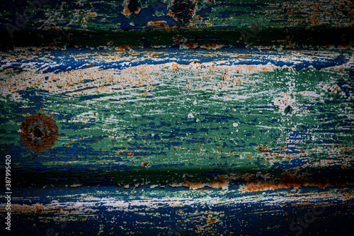 A holey old blue metal fence