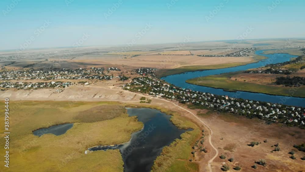 Aerial view of little european villages with small houses near river. Beautiful nature landscape Aerial view of little european villages with small houses near river. Beautiful nature landscape