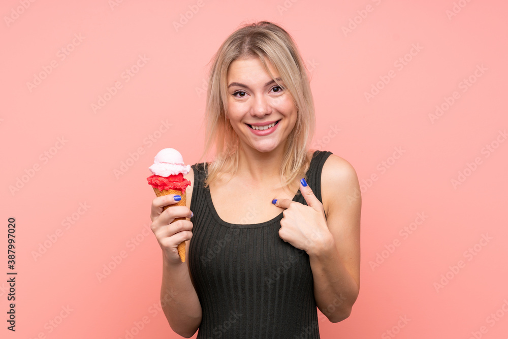 Young blonde woman with a cornet ice cream over isolated pink background with surprise facial expression Young blonde woman with a cornet ice cream over isolated pink background with surprise facial expression