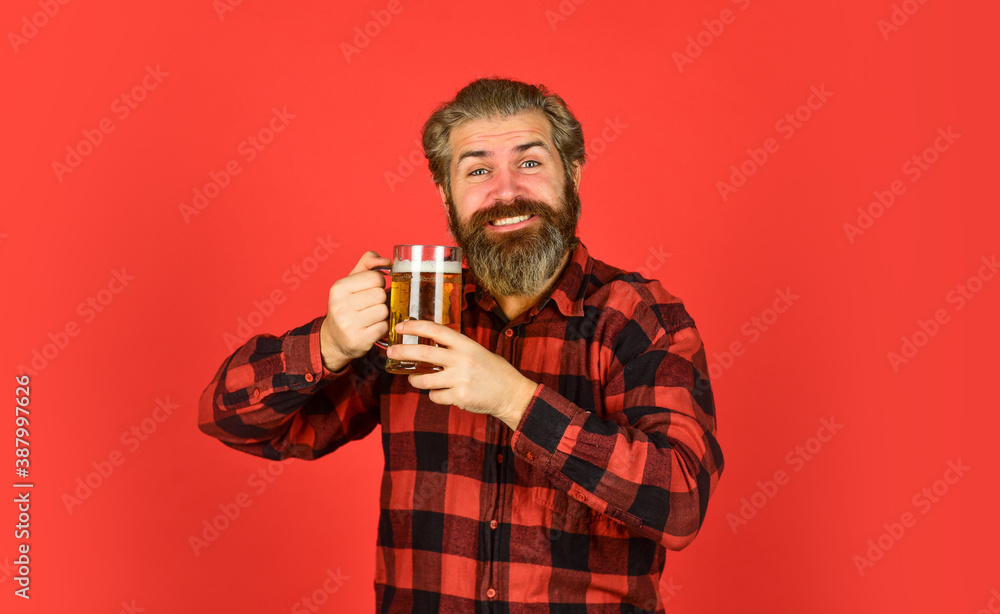 Retro advertising of alcoholic beverage. Stylish bartender or barman in bar. Man hold glass of beer. hipster at bar counter. having fun watching football. Brutal male drinks beer from glass. Beer pub Retro advertising of alcoholic beverage. Stylish bartender or barman in bar. Man hold glass of beer. hipster at bar counter. having fun watching football. Brutal male drinks beer from glass. Beer pub