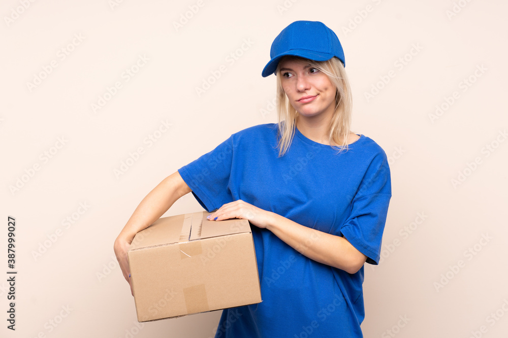 Young delivery woman over isolated background thinking an idea Young delivery woman over isolated background thinking an idea