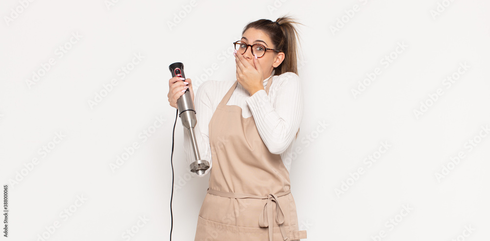 Εκτύπωση καμβά young blonde woman covering mouth with hands with a shocked, surprised expressio