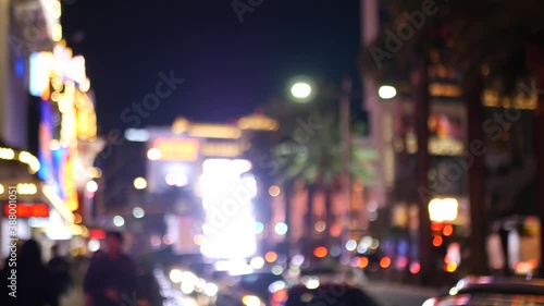 Defocused fabulous Las Vegas Strip boulevard, luxury casino and hotel, gambling area in Nevada, USA. Nightlife and traffic near Fremont street in tourist money playing resort. Neon lights of sin city.