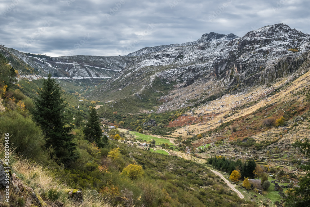 Landscape panorama of Serra da Estrela Natural Park, vegetation with autumn colors mountains with snow - Manteigas PORTUGAL