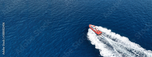 Fotografie Aerial drone ultra wide photo of small pilot vessel cruising near mediterranean