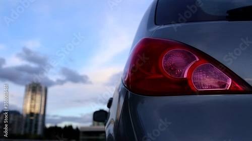 Flashing orange blinker light on rear lamp