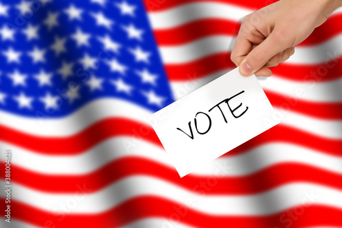 hand drops the ballot election against the background of the flag USA, concept of state elections, referendum
