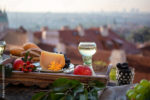 Photography Breakfast on a balcony, with panorama of Prague in the background