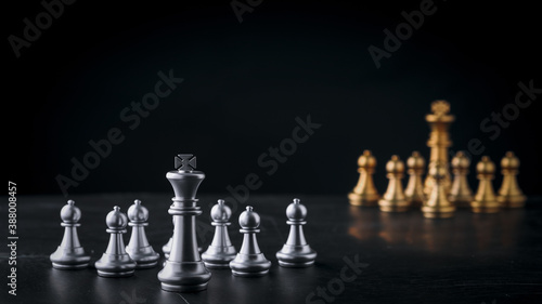 Business chess board game of business strategy and tactic on retro wooden table, idea for management competition, success and leadership concept with copy space for your advertising content.