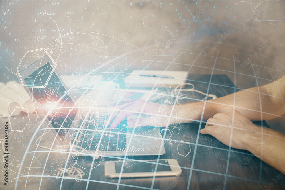 Fototapeta premium Multi exposure of world map hologram with man working on computer on background. Concept of worldwideweb.