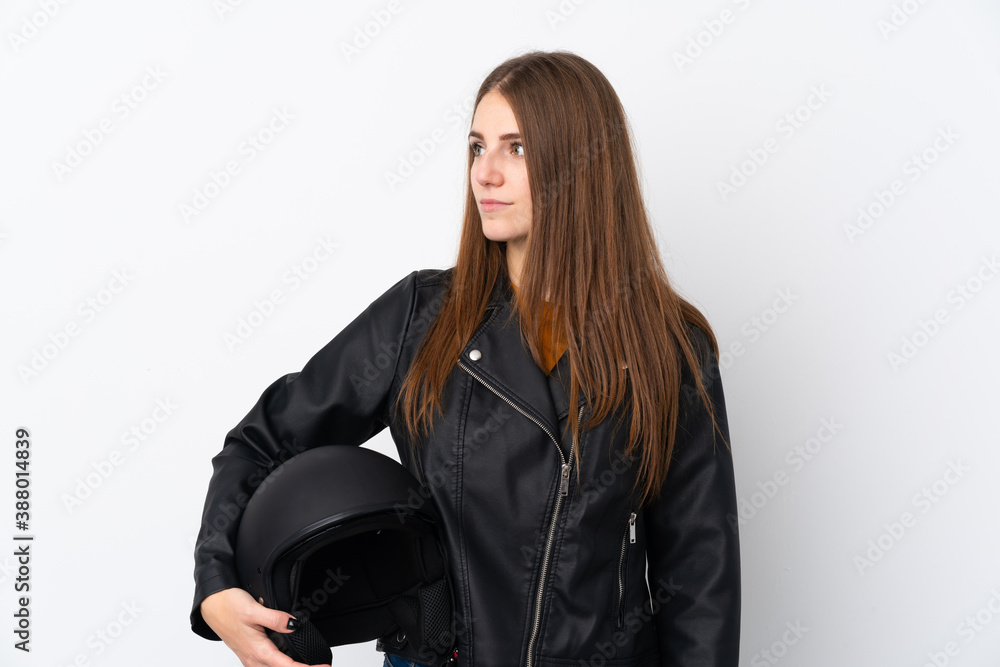 Woman with a motorcycle helmet looking side Woman with a motorcycle helmet looking side