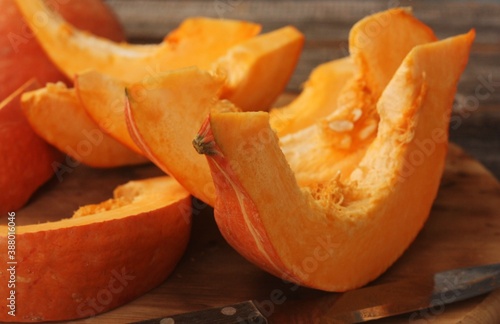 Fresh ripe pumpkin on a wooden table  