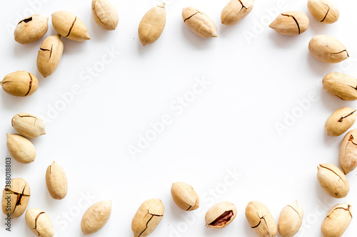 Frame of pecan nuts. Food background, top view