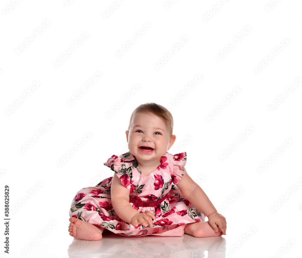 Pretty baby in beautiful dress sitting on floor Pretty baby in beautiful dress sitting on floor