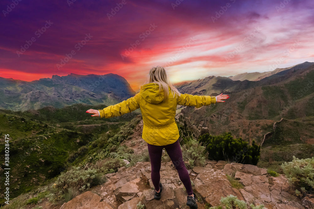 Fototapeta premium A person standing on a rocky hill
